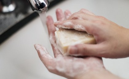 Hands washing with soap.